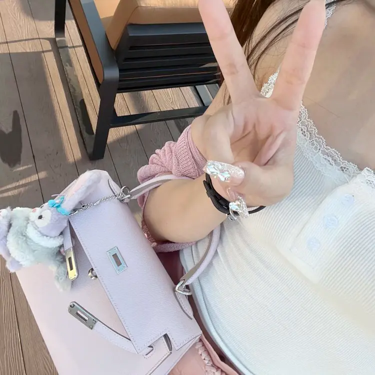 Replica Kelly 25 Mauve Pale Epsom in Urban Fashion Setting Street style fashion with Replica Hermes Kelly 25cm Mauve Pale Epsom bag