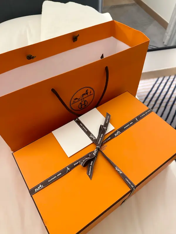 Premium Hermes packaging included with all replica sneaker orders Luxury replica Hermes sneaker packaging - orange gift box and shopping bag