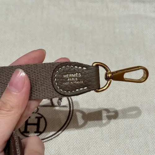 Hermes Evelyne Replica Strap Branding Detail Hermes Paris logo stamp on canvas strap of Evelyne TPM replica bag