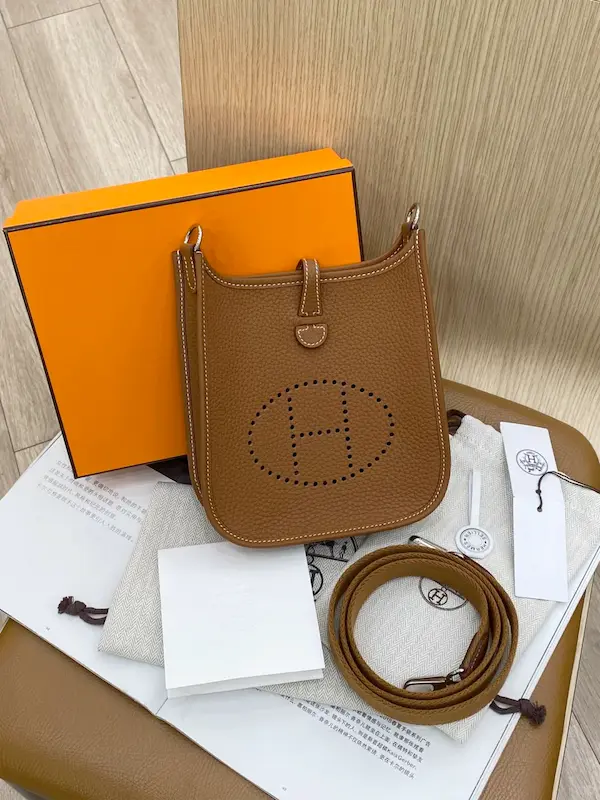 Premium Hermes Evelyne TPM Replica Unboxing Experience Gold Hermes Evelyne 16 replica unboxing with orange box and dust bag
