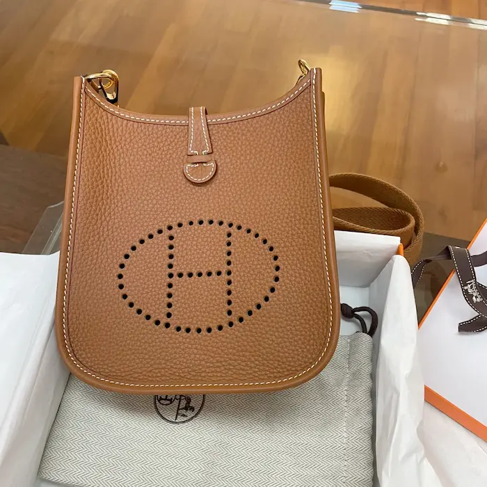 Gold Hermes Evelyne TPM Replica Unboxing Experience Gold Clemence leather Hermes Evelyne TPM replica unboxing with signature orange box