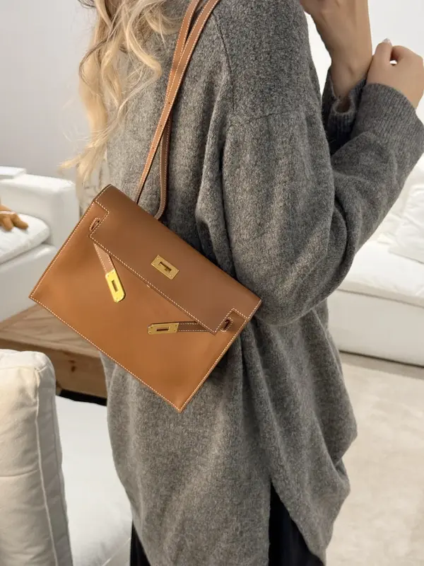 Golden Brown Replica Hermes Kelly Danse worn as shoulder bag with business attire