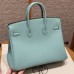 Close-up of the authentic silver lock and keys for the best replica Hermes Blue Atoll Birkin 25