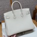 Close-up of the authentic silver lock and keys for the best replica Hermes Craie Birkin 25