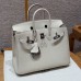 Side profile showing the sturdy silver sangles and plaqué on the best replica Hermes Craie Birkin 25.