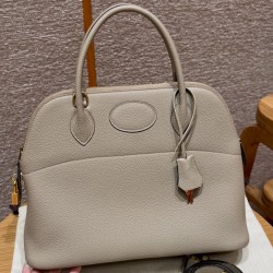 Replica Hermes Bolide 31 Bag in Girs Tourterlle Togo leather with zip-top closure.