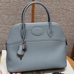 Replica Hermes Bolide 31 Bag in Blue Lin Togo leather with zip-top closure.