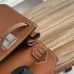 Replica Hermes Jypsiere 28 - Crossbody Carry Style Wearing the black Togo leather replica Hermes Jypsiere 28 as crossbody.