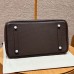 Base of the replica Hermes Birkin 35CM chocolate bag with protective feet.